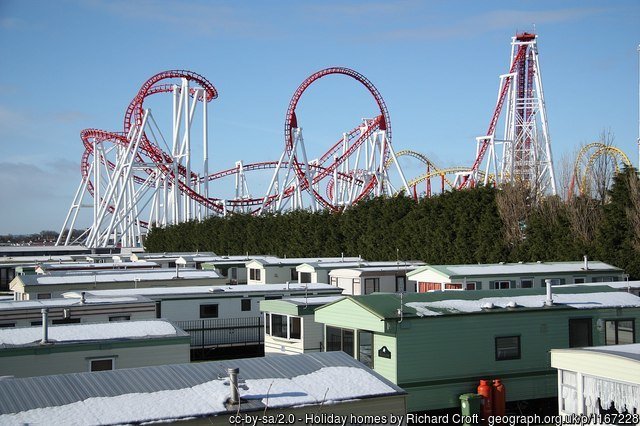 Holiday homes Static caravans at Ingoldmells with the Fantasy Island roller coaster looming behind